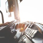 person-hand-on-steering-wheel-977213
